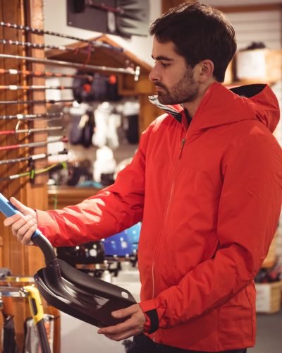 man-selecting-shovel-shop man-selecting-shovel-shop
